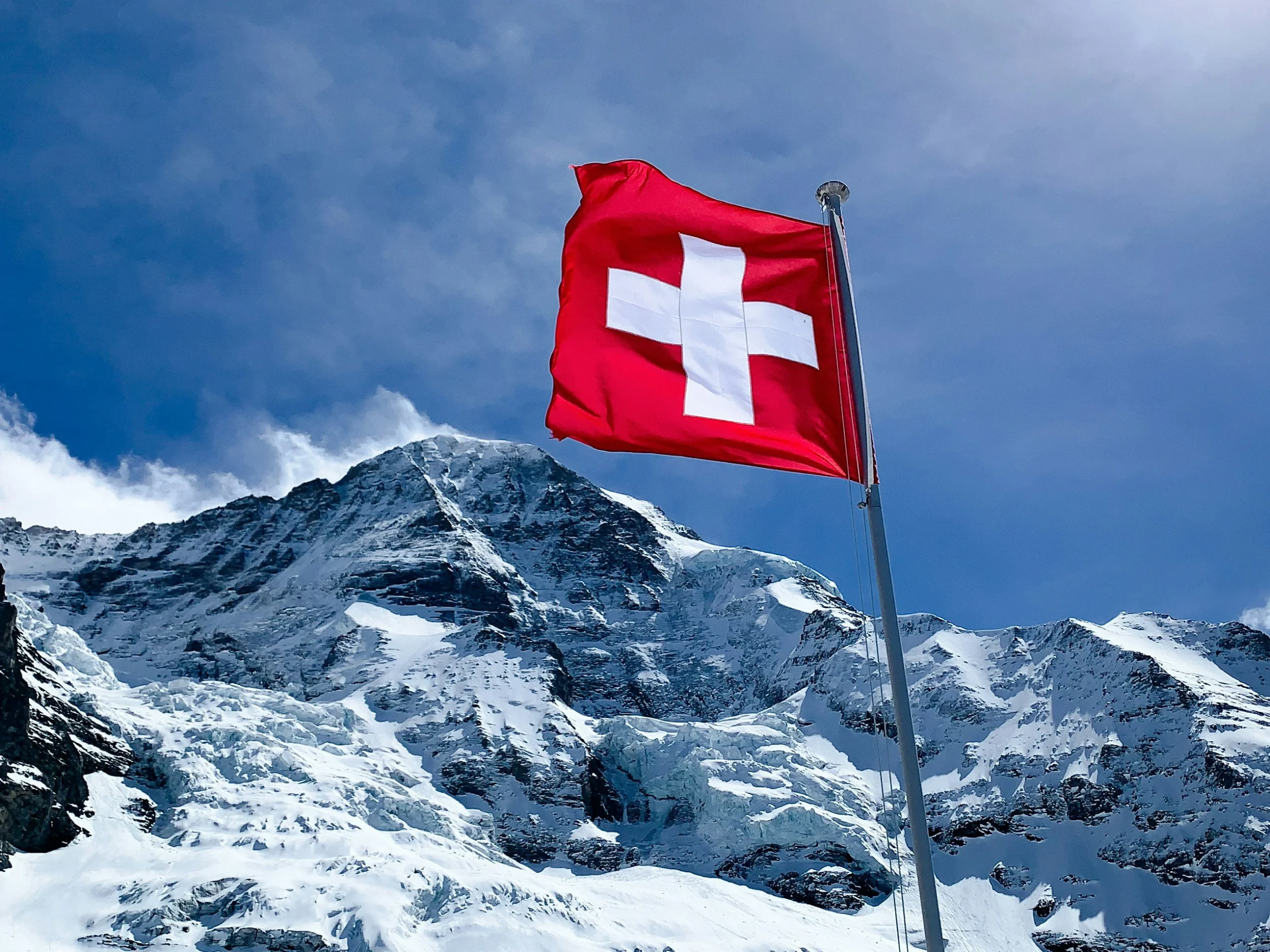 Swiss flag on an alpine summit